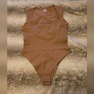 Brand new (took out of bag for pictures) bodysuit.